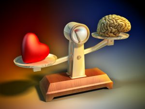 Heart and brain on a balance scale. 