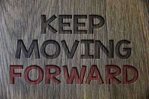 Keep Moving Forward. Business photo showcasing improvement Career encouraging Go ahead be better Wooden wood background black engraved letters ideas messages concepts.