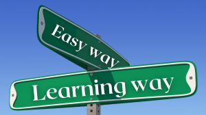 Street sign with one sign saying "Easy way" and the other saying "Learning way"