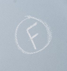 A circled student grade of "F" in chalk