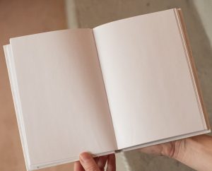 open textbook with blank pages shown